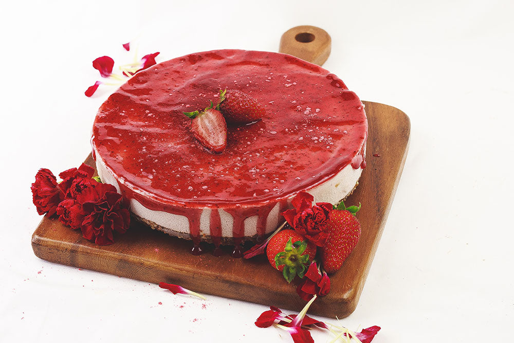 Strawberry cheesecake with flowers and strawberries decoration