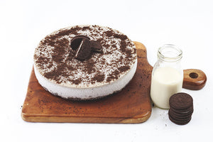 Oreo Cheesecake with milk and Oreo on a side 