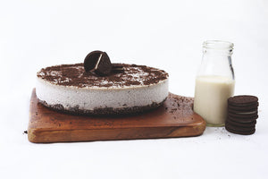 Oreo Cheesecake with milk and Oreo on a side 