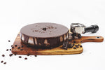 Mocha cheesecake with chocolates and coffee beans all-around