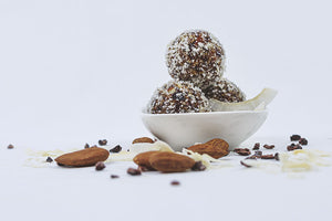 
            
                Load image into Gallery viewer, Raw truffles in a bowl with Almonds and shredded chocolates all-around
            
        