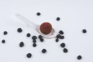 Blueberry Truffle with spoon and dry blueberries